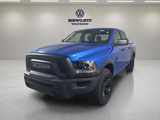 2024 RAM 1500 Classic Warlock in Hydro Blue Pearlcoat — front three-quarter view