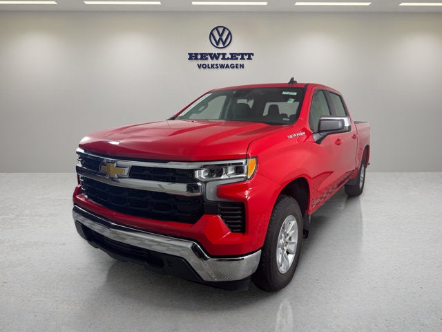 2025 Chevrolet Silverado 1500 LT in Red Hot — front three-quarter view