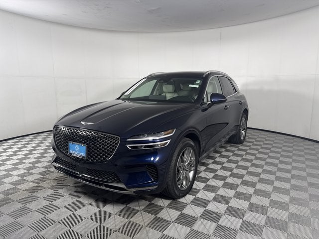 2024 Genesis GV70 2.5T in Capri Blue — front three-quarter view