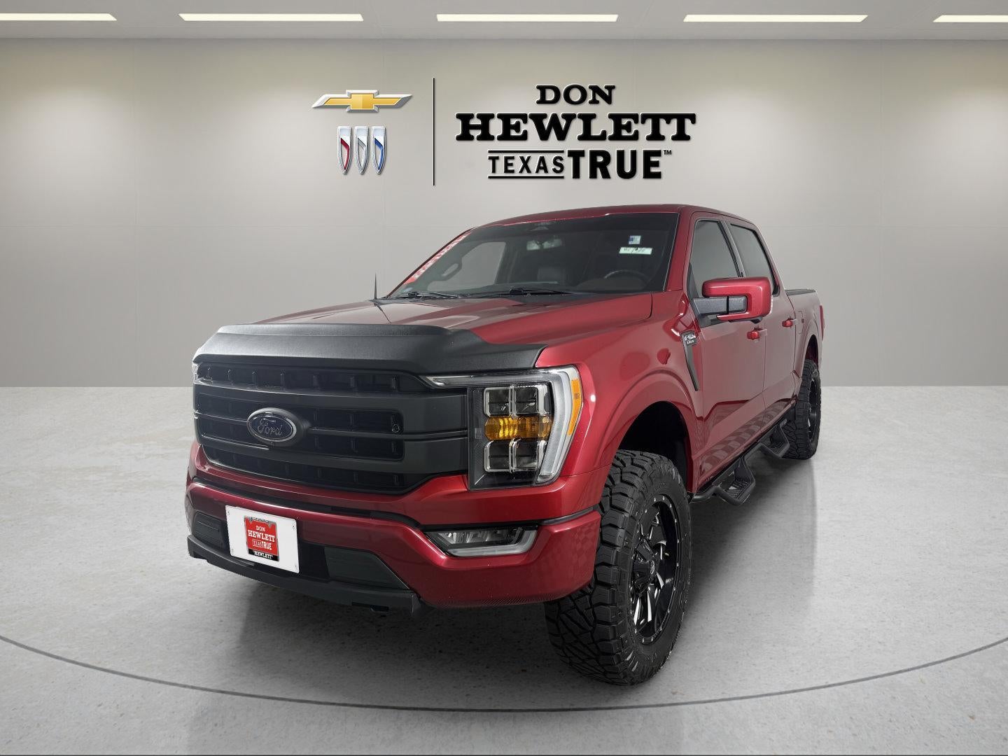 2022 Ford F-150 LARIAT in Red — front three-quarter view