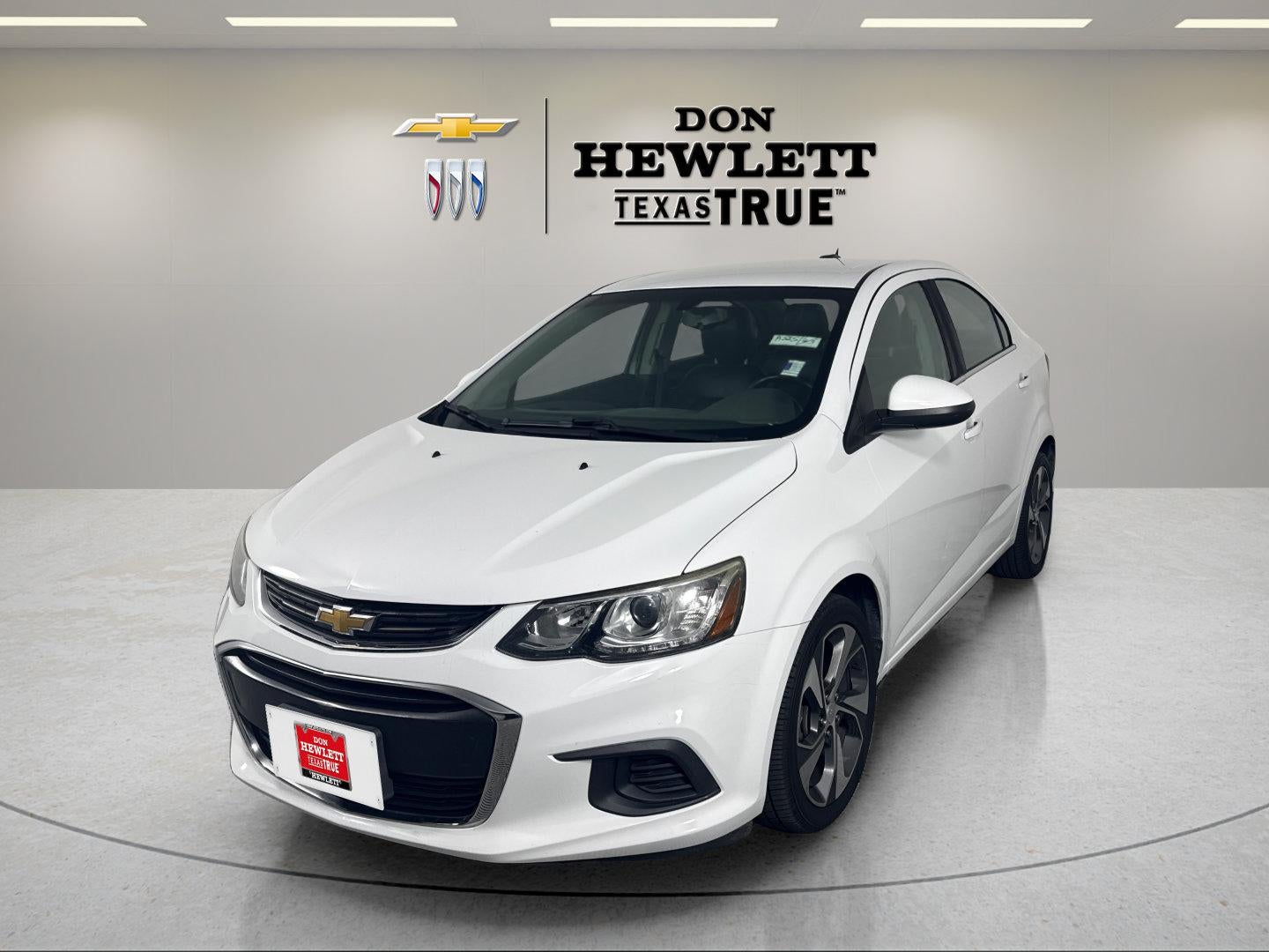 2018 Chevrolet Sonic Premier in Summit White — front three-quarter view