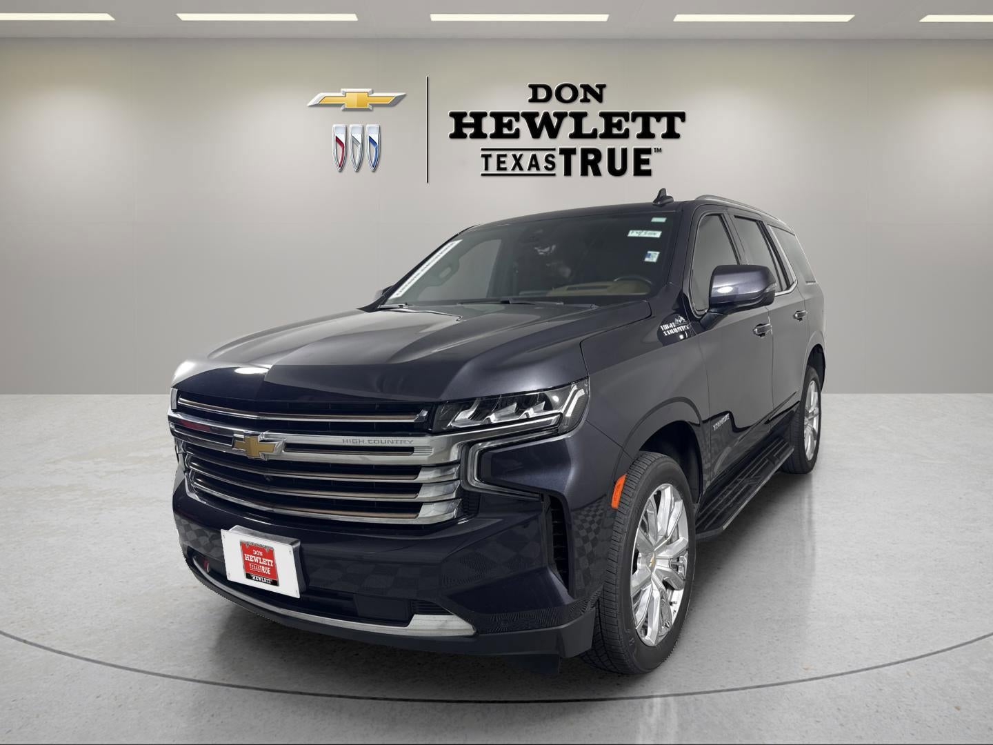 2023 Chevrolet Tahoe High Country in Dark Ash Metallic — front three-quarter view