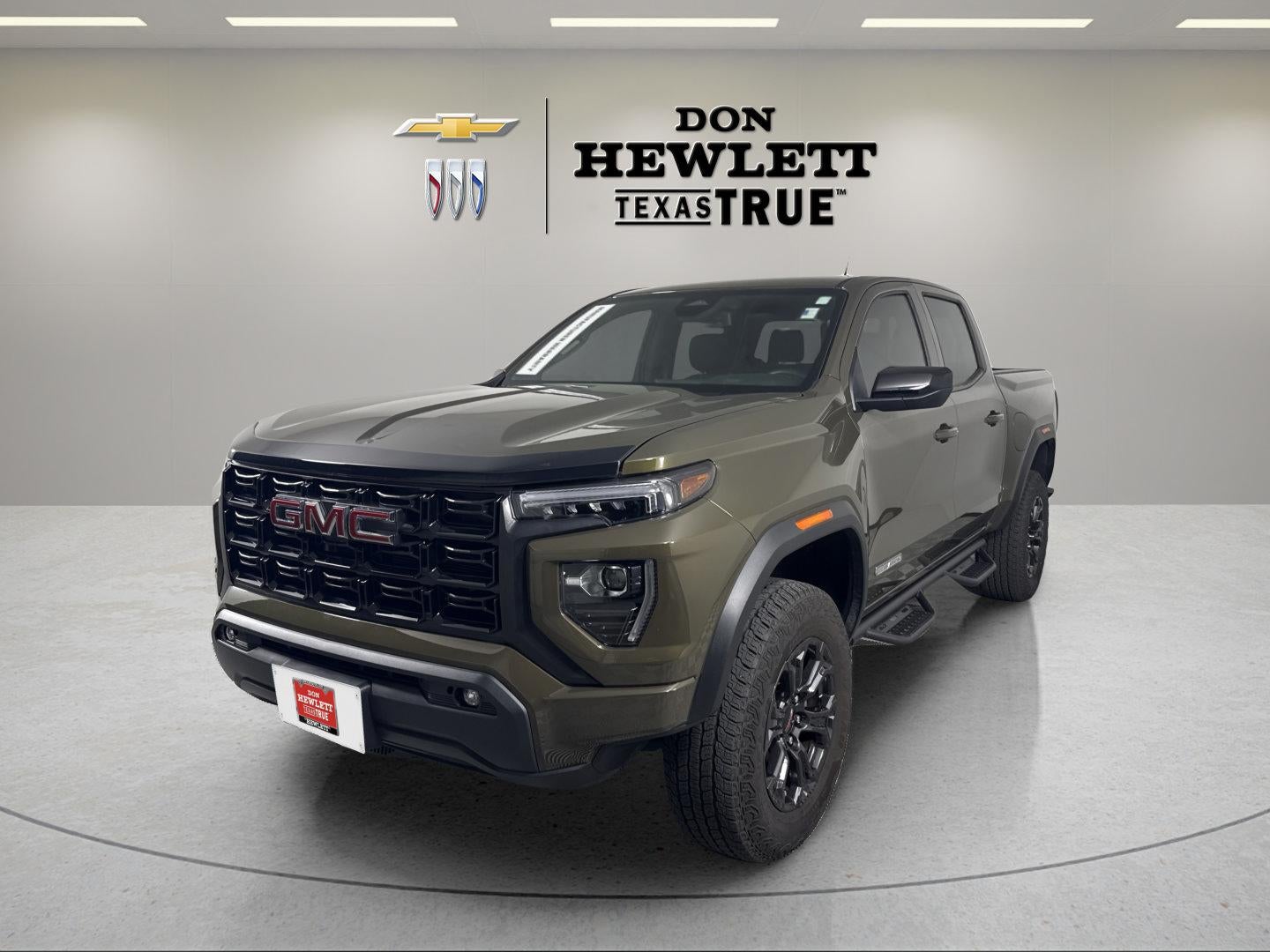 2025 GMC Canyon Elevation in Deep Bronze Metallic — front three-quarter view