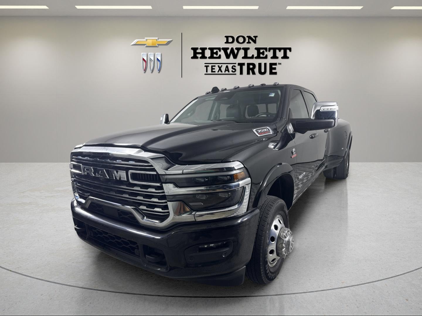 2025 RAM 3500 Limited Longhorn Crew Cab 4x4 8' Box in Black — front three-quarter view