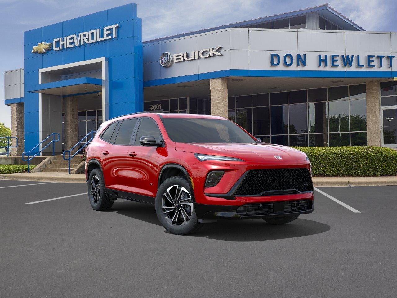 2026 Buick Enclave Sport Touring in Cherry Red Tintcoat — front three-quarter view