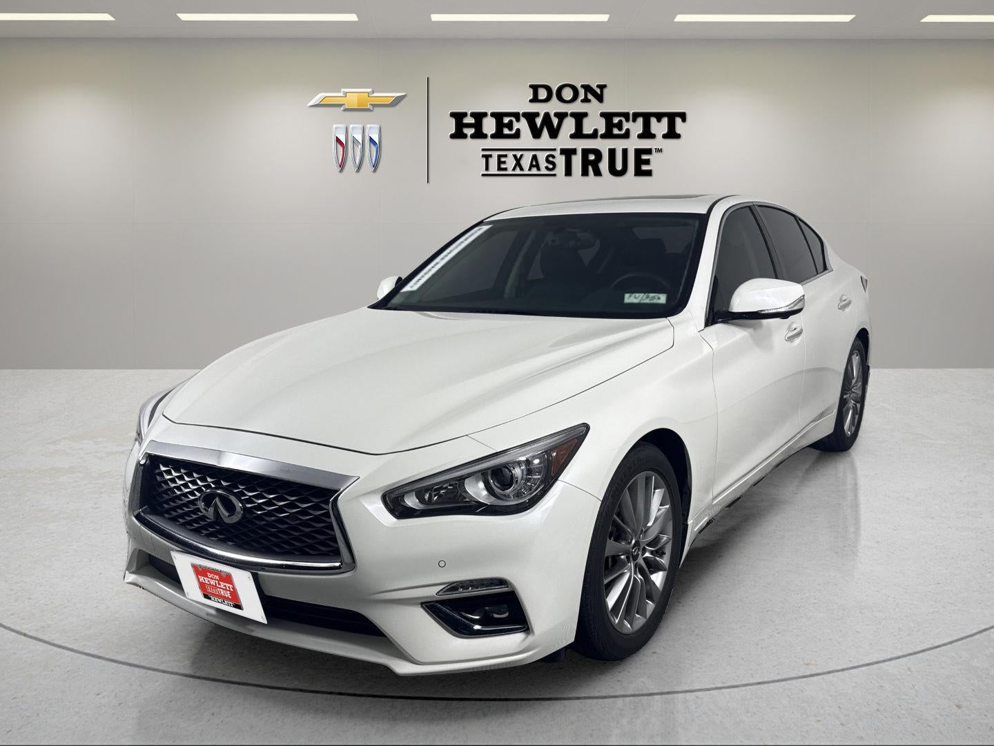 2023 INFINITI Q50 LUXE in White — front three-quarter view