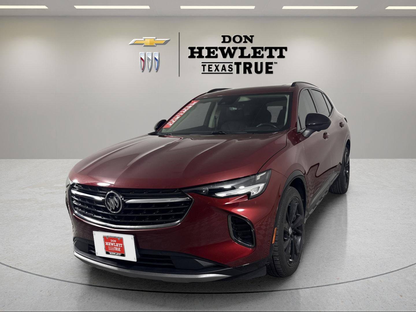 2022 Buick Envision Essence in Cinnabar Metallic — front three-quarter view