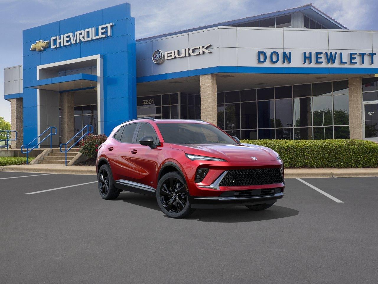 2026 Buick Envision Sport Touring in Brilliant Red — front three-quarter view